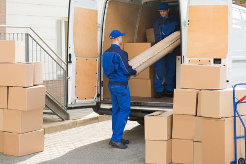 Man with van loading furniture for a local move in Ruislip