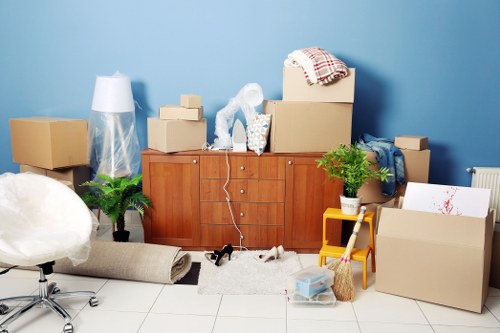 Local removals team planning a move in Ruislip with boxes and furniture