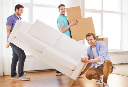 Local movers handling furniture access challenges on a Ruislip street