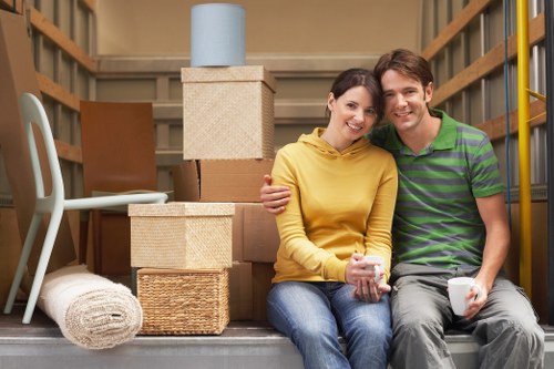 Professional movers handling boxes and furniture locally