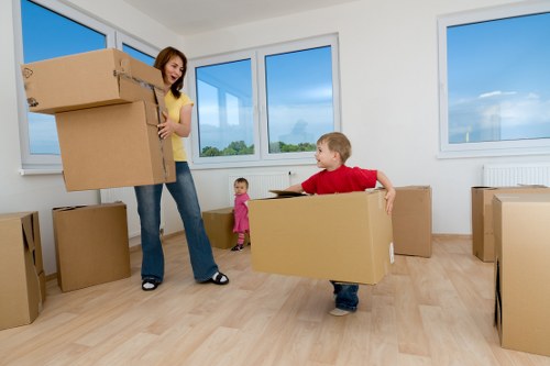 Removal team transporting office items through a local Ruislip property