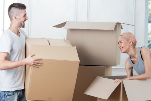 Packed moving boxes and furniture ready for transport in a Ruislip property