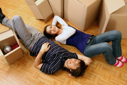 Moving crew loading furniture into a vehicle